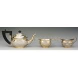 An Indian silver three piece tea service comprising: teapot, sucrier and milk jug,