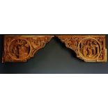 A pair of Chinese corbels, each carved with pairs of roundels,