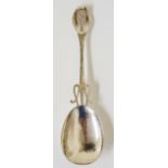 An Arts and Crafts handcrafted silver spoon, the neck of the spoon pierced, hammer textured body,