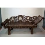 An unusual Chinese hardwood long bench, the back carved bamboo branches,