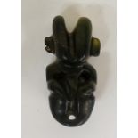 A carved green hardstone amulet, 6.