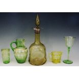 A selection of Victorian and Edwardian green glass to include: a small green jug and beaker,