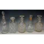 A collection of 19th and 20th Century decanters to include: a near pair of Victorian mallet shaped