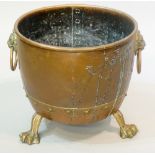 A Victorian cauldron shaped fuel bin with pair of lion mask and ring handles,