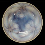 An opalescent glass bowl depicting bunches of cherries and foliage in relief to underside,