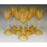 A set of eight Art Deco Stuart hock glasses, flash cut in amber and clear hues,