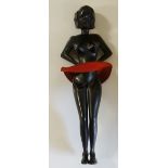 A novelty ebony sprung paper clip in the form of a semi-clad female figure,