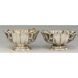 A pair of Russian silver coloured metal caviar dishes with fluted sides and stepped conforming feet,