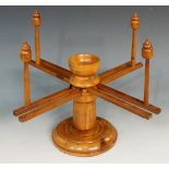 A yew wood wool winder of conventional design on circular base, 35cm wide,