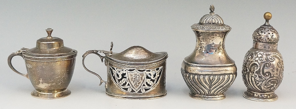 A selection of silver items to include: a pepperette, half lobed body, acorn finial,