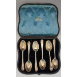 A Victorian cased set of six teaspoons with stylised leaf bowls, each engraved with the initials YM,