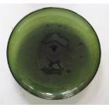 Copier (Leerdam) - A large glass shallow dish with dark green ground,