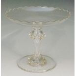 A mid Victorian scalloped edged tazza, the hollow stem decorated with applied swirls,