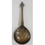An unusual Norwegian silver folding spoon, cast scrolls and double headed terminal,