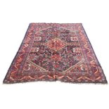 A Ziegler Mahal rug, central red diamond medallion on blue ground filled with red,