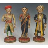 Three 19th Century Indian carved wooden figures, polychrome decorated,