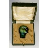 A fine enamel parasol handle terminal finely modelled as a parrot's head with bright green shaded