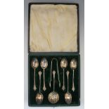 A cased set of six teaspoons, tongs and a sugar sifter,