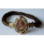 A Victorian gilt metal mounted jeweled oval head and shoulder portrait miniature plaque choker,