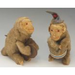 Two German clockwork plush monkey musicians, one playing a drum the other cymbals, 23cm high max.