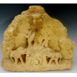 An archaic stone carving of a seated deity flanked by pair of leopards, 27cm high,