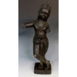 A carved figure of Krishna,