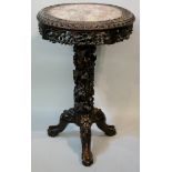 A Chinese hardwood circular pedestal table,