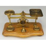 A set of brass postal scales,