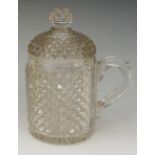 A Victorian diamond cut glass tankard, conforming knopped cover, applied handle, star cut base,