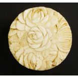 A late 19th Century Japanese circular carved ivory box,