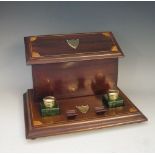 An Edwardian inlaid mahogany stationery box the letter rack with hinged lid and vacant shield