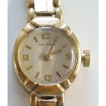 A ladies 9ct gold Rotary wristwatch, the champagne dial inscribed Rotary with Arabic numerals at 12,