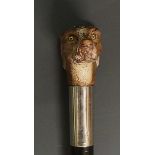 An early 20th Century walking stick, the wooden handle carved and painted as a whippet's? head,