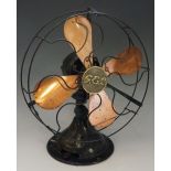 A GEC War Finish desk fan with coppered blades and black lacquer frame centred on a brass GEC logo,