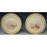 A pair of Royal Doulton cabinet plates painted to the centres with black grouse and partridge by T.