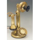 A vintage brass telephone,