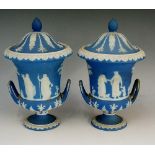 A pair of Wedgwood two handled pedestal vases and covers,