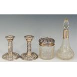 A selection of silver items to include: a pair of candlesticks,