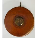 A GWR tape measure the leather case with brass fittings inscribed 100 ft by John Rabone & Sons,