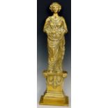 A Victorian brass door porter cast as a young woman holding basket of fruit on a draped pedestal,