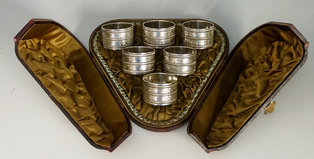 A set of six silver plated napkin rings,