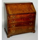 A George III oak bureau, the fall-flap revealing conventionally fitted interior with pigeon holes,