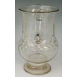 A 'King's shilling' glass tankard, the bellied body engraved with the initials H I above foliage,