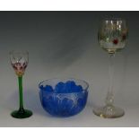 An Art Nouveau Austrian wine glass in the manner of Theresienthal, with green glass stem,