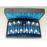 A set of twelve Edwardian demi-tasse spoons and a pair of sugar tongs,