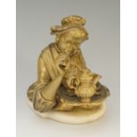 An interesting Victorian brass novelty inkwell modelled as the upper body of a female,