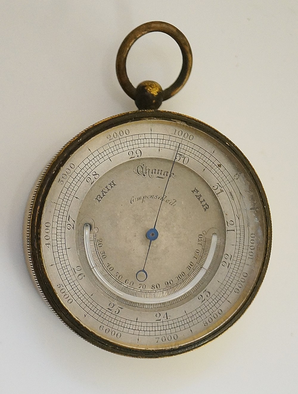A Victorian lacquered brass cased compensated barometer with thermometer, silvered dial, 4.
