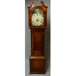 A George IV oak longcase clock outlined throughout with mahogany crossbanded borders the swan neck