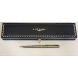 A sterling standard chequer cut Parker pen with black onyx terminal, gold plated clip,