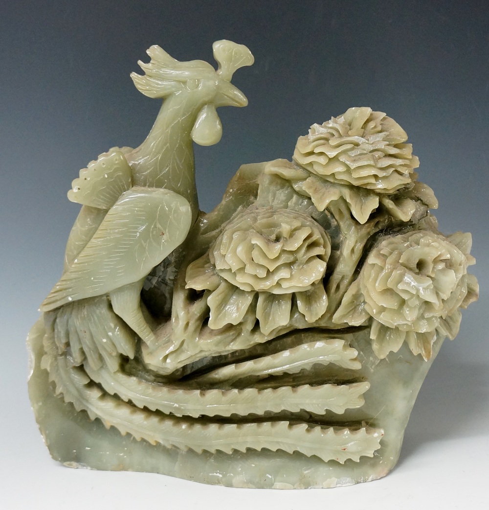 A large jadeite carving of a bird and floral blooms, 34cm high,